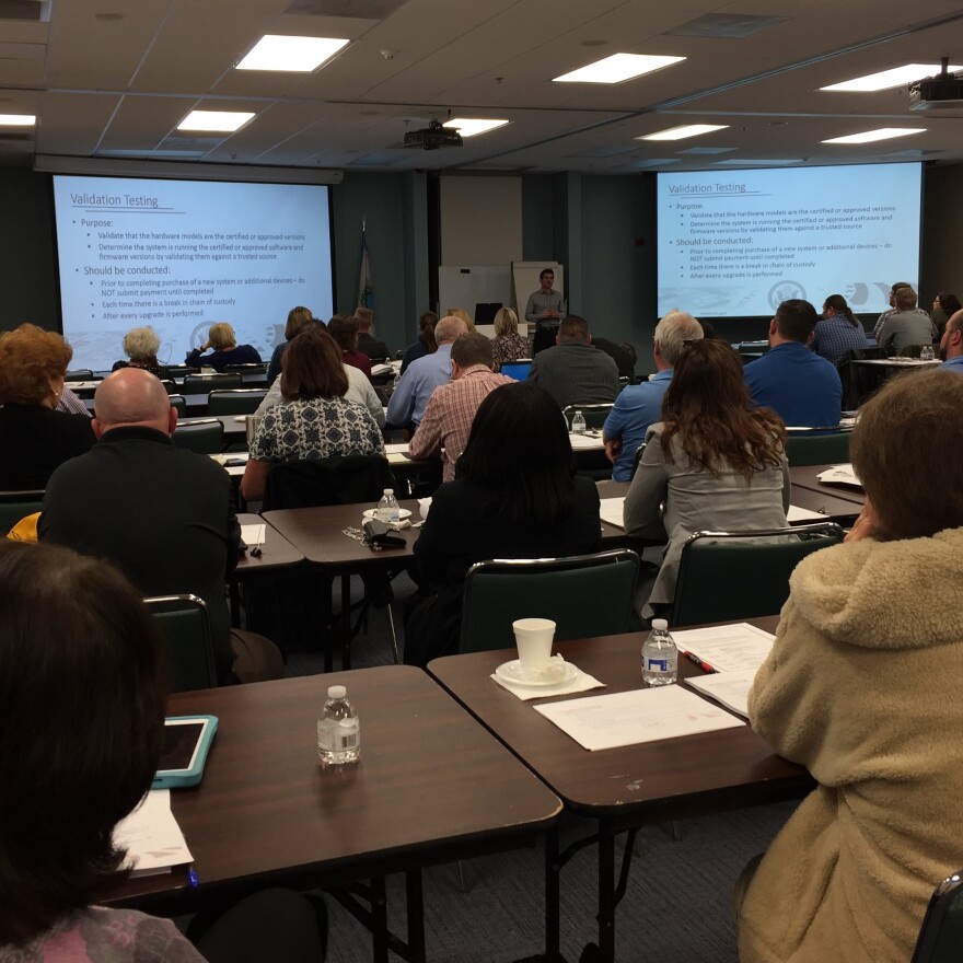 Several dozen Florida county supervisors of elections and IT workers are briefed on some of the many threats faced by election systems today and ways to guard against them.